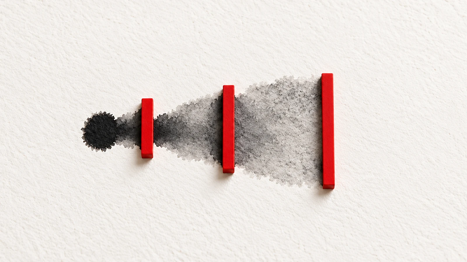 Charcoal ink widens across off-white paper and stops at three red ceramic hold points before clean paper.
